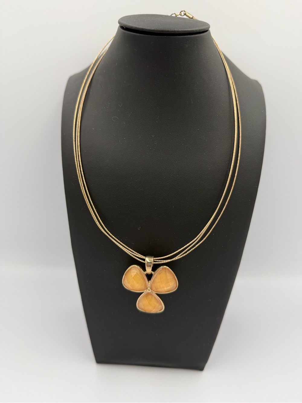 Gold Triple-Petal Pendant Necklace with Amber-Tone Stones